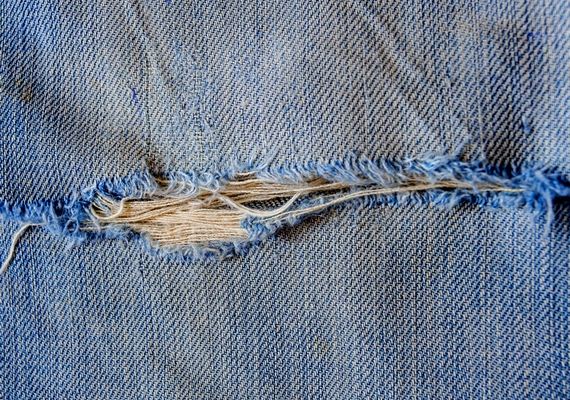 torn old blue jeans